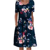 Vestido Aurora floral verde com estampa lisa delicada, ideal para ocasiões casuais e elegantes, com mangas curtas e caimento leve para o verão.