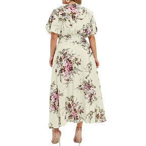 Vestido Aurora floral verde claro com estampa lisa delicada, ideal para ocasiões casuais e elegantes, com mangas curtas e caimento leve para o verão.