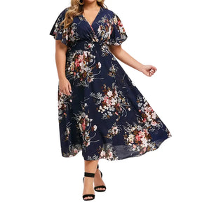 Vestido Aurora floral azul marinho com estampa lisa delicada, ideal para ocasiões casuais e elegantes, com mangas curtas e caimento leve para o verão.