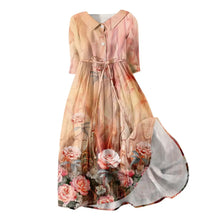 Vestido Aurora longo com estampa floral delicada, ideal para ocasiões casuais e elegantes, com mangas curtas e caimento leve para o verão.