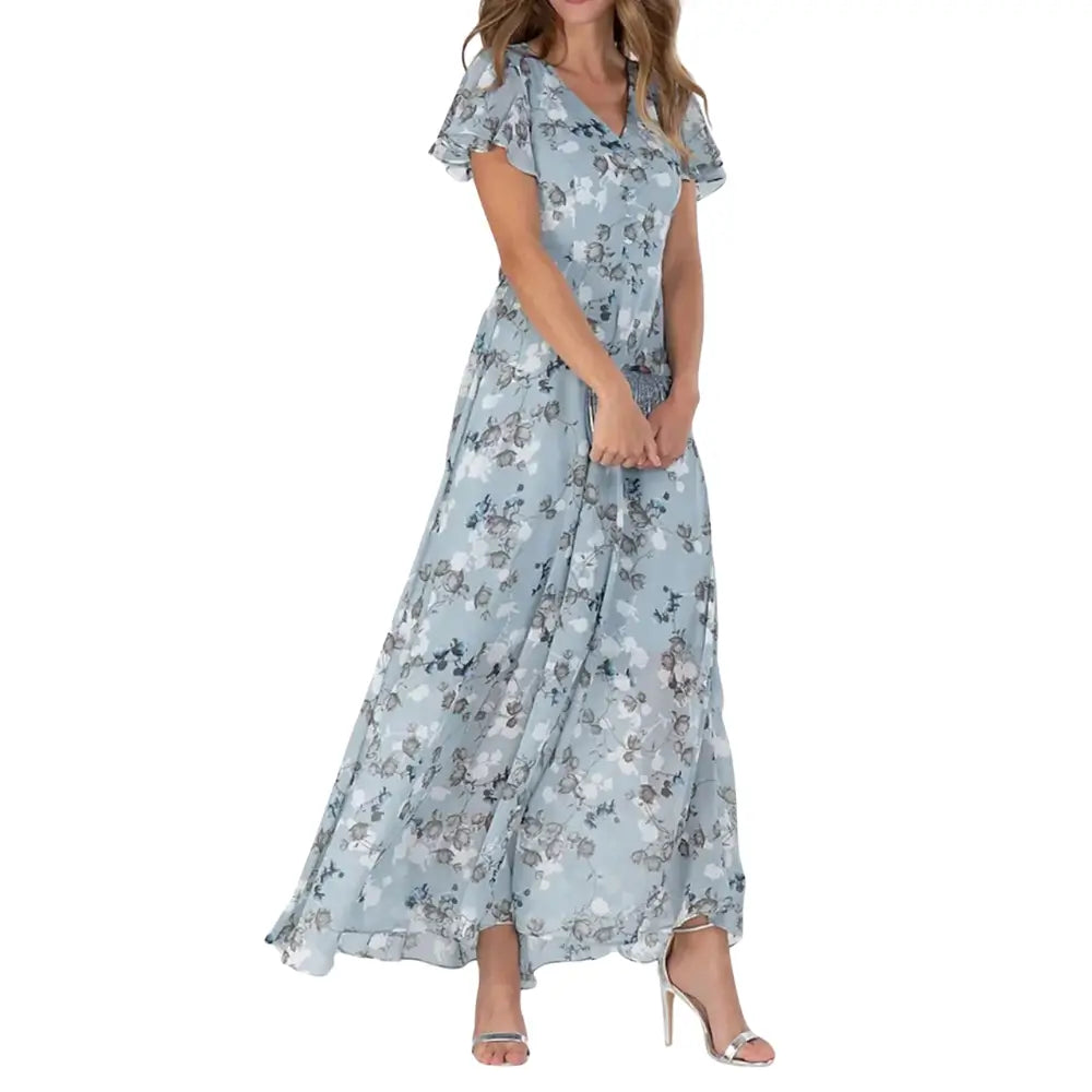 Vestido Aurora floral azul com estampa lisa delicada, ideal para ocasiões casuais e elegantes, com mangas curtas e caimento leve para o verão.