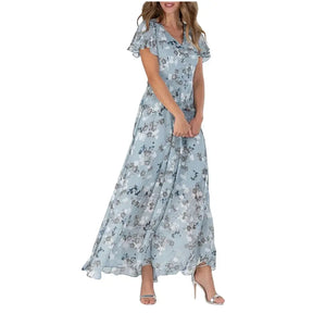 Vestido Aurora floral lilas com estampa lisa delicada, ideal para ocasiões casuais e elegantes, com mangas curtas e caimento leve para o verão.